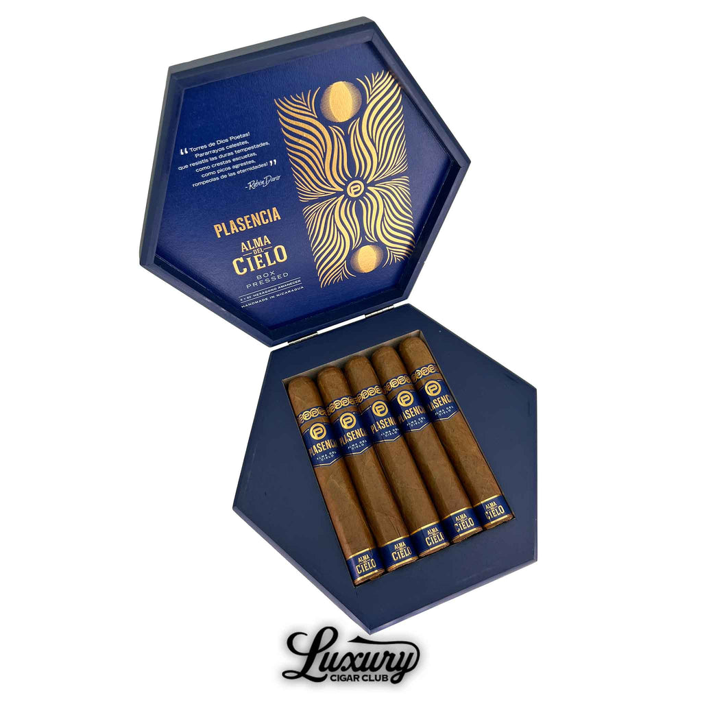 Open box of Plasencia Alma Del Cielo Amanecer Hexagono cigars with blue and gold packaging from Luxury Cigar Club.