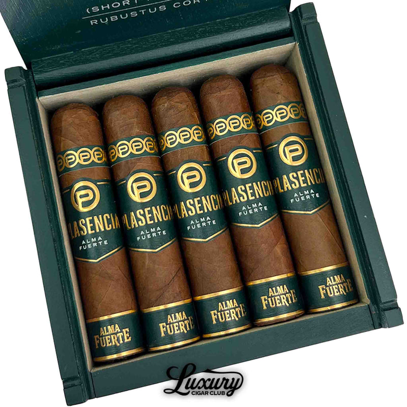 Close-up of Plasencia Reserva Original Corona Corta cigars showing smooth, natural wrappers and refined gold-embossed bands inside a cedar-lined box from Luxury Cigar Club.