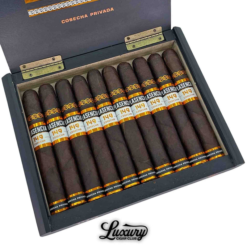 Close up box of Plasencia Cosecha 149 Azacualpa cigars, showing 10 dark-wrapped cigars with black, gold, and white bands, placed neatly in a black and wood box with “Cosecha Privada” branding on the inside lid.
