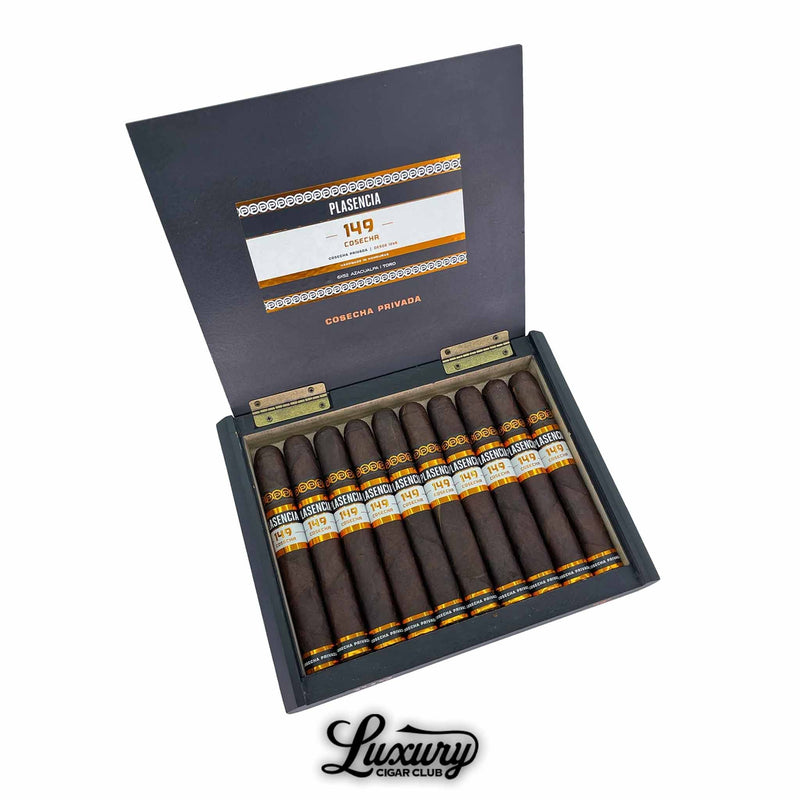 Open box of Plasencia Cosecha 149 Azacualpa cigars featuring 10 dark-wrapped cigars with black, white, and gold bands, neatly arranged inside a black and gold-trimmed box labeled "Cosecha Privada" with the Luxury Cigar Club logo below.