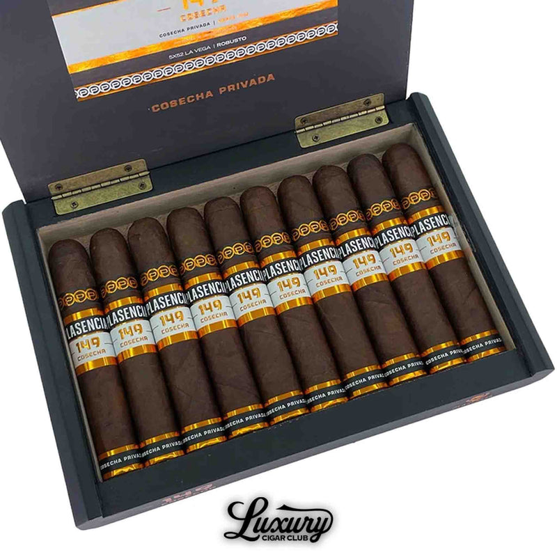 Close-up of an open box of Plasencia Cosecha 149 La Vega cigars, showing 10 robusto cigars with dark brown wrappers and bold black, white, and gold bands, arranged in a black box marked “Cosecha Privada” with the Luxury Cigar Club logo.
