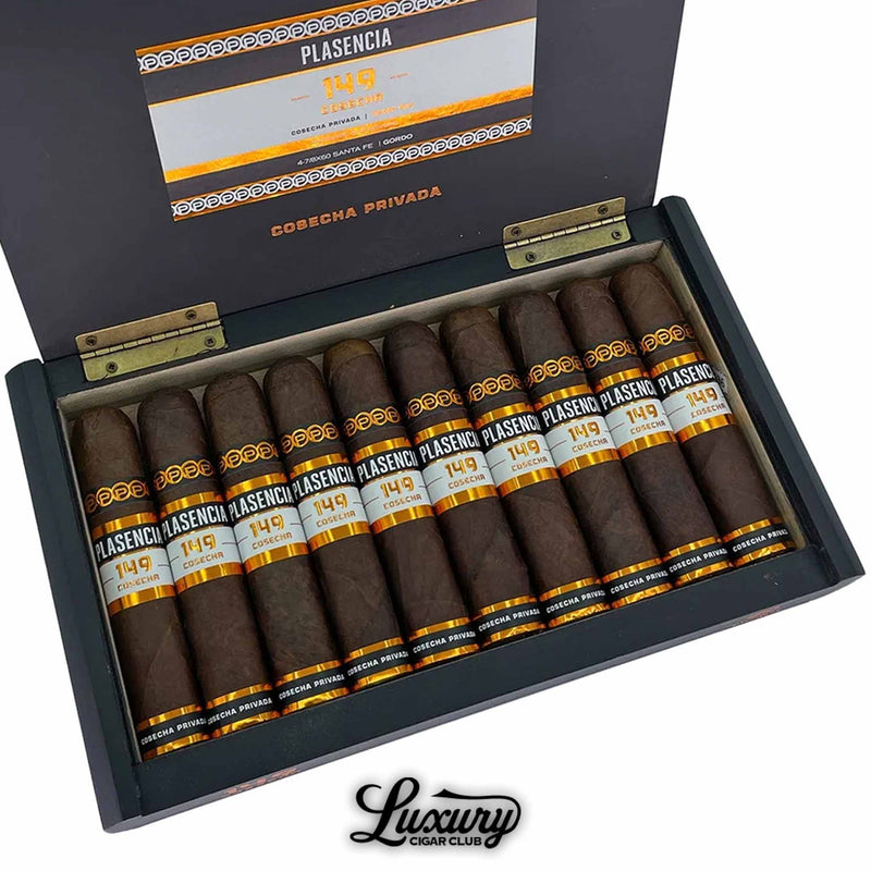 Close-up view of a box of Plasencia Cosecha 149 Santa Fe cigars, showing 10 dark-wrapped cigars with black, orange, and white bands, neatly arranged inside a black box labeled "Cosecha Privada" with "Luxury Cigar Club" branding.