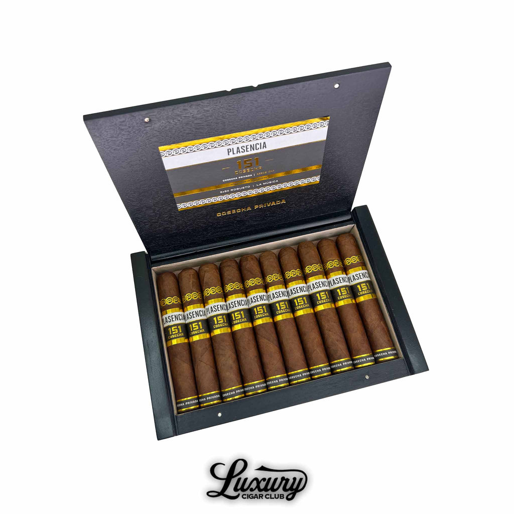 Open black box containing 10 premium Plasencia Cosecha 151 La Música Robusto cigars with golden and black bands, presented by Luxury Cigar Club.