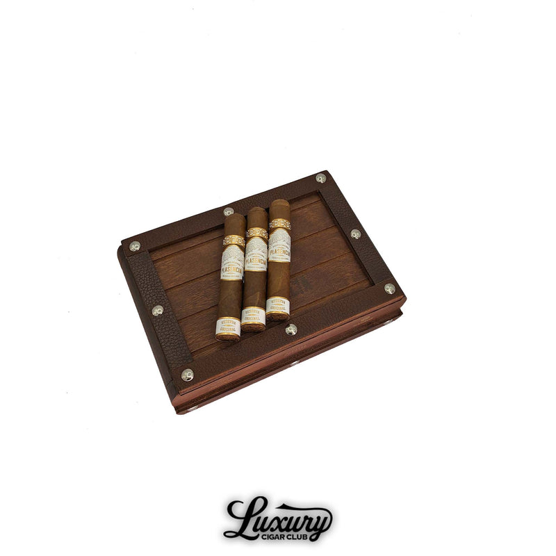 Plasencia Reserva Original Robusto cigars displayed on wooden box lid with rustic hardware — premium organic Nicaraguan cigars from Luxury Cigar Club.