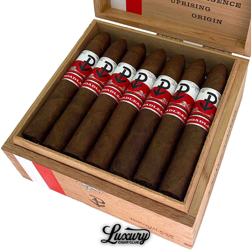 Close up of Powstanie Broadleaf Belicoso cigars inside wood box showing rustic broadleaf wrappers and bold Powstanie branding by Luxury Cigar Club