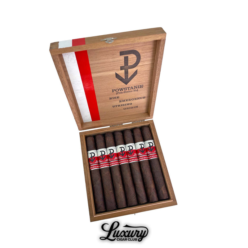 Powstanie Broadleaf Toro cigars arranged in open wood box with heavy red stripe and Powstanie insurgent logo shown for sale by Luxury Cigar Club