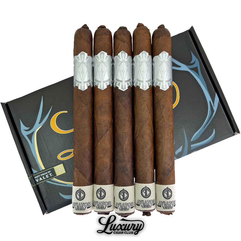 Close-up of Principle Aviator Prominente LCC Exclusive Figurado cigars emphasizing the elegant silver bands and dark wrapper texture, presented by Luxury Cigar Club.