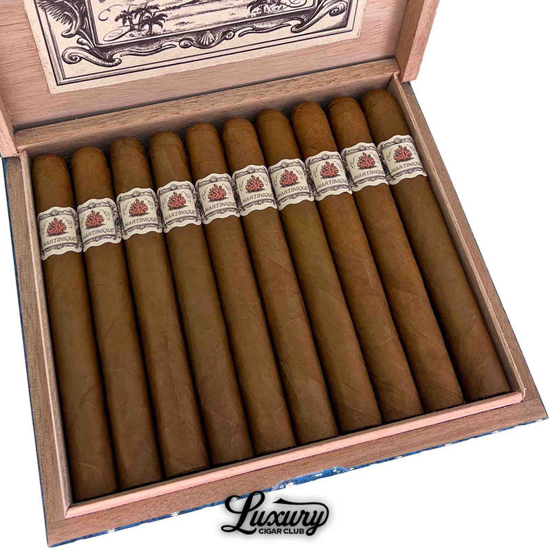 Close-up of Principle Martinique cigars neatly arranged in an open cedar box, highlighting the refined light brown wrappers and detailed vintage-inspired band design, presented by Luxury Cigar Club.