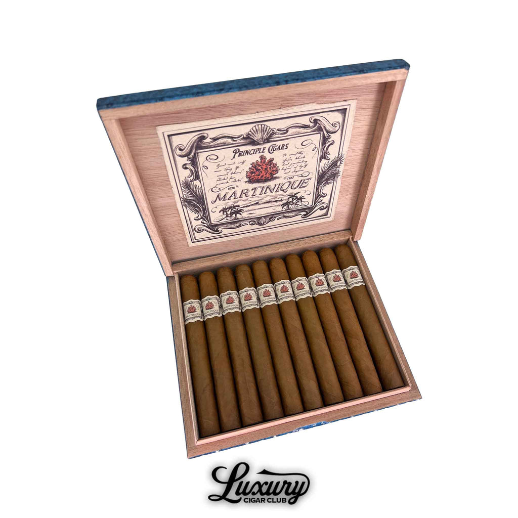 Principle Martinique cigars displayed in an open wooden box with elegant vintage-style branding, showcasing smooth golden-brown wrappers and ornate white bands, presented by Luxury Cigar Club.