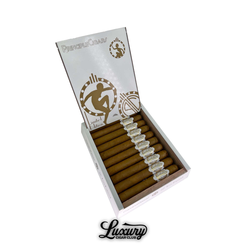 Open white and gold box of Principle Cigars White Gold 10th Anniversary Toro featuring elegant Connecticut-wrapped cigars with gold-embossed bands arranged neatly. Luxury Cigar Club logo displayed below.
