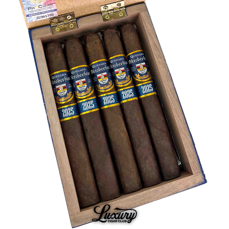 Close-up of Quesada Oktoberfest 2025 Kaiser Ludwig cigars in box, highlighting rich brown wrappers and detailed blue-and-gold bands, from Luxury Cigar Club.