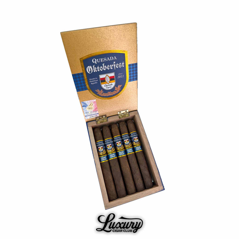 Open box of Quesada Oktoberfest 2025 Kaiser Ludwig cigars with golden lid and Oktoberfest crest, showcased at Luxury Cigar Club.