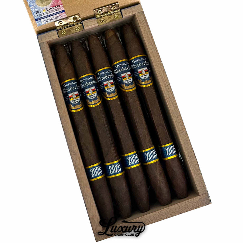 Close-up of Quesada Oktoberfest 2025 Salomon cigars inside wooden box, featuring dark wrappers and bold blue bands, from Luxury Cigar Club.