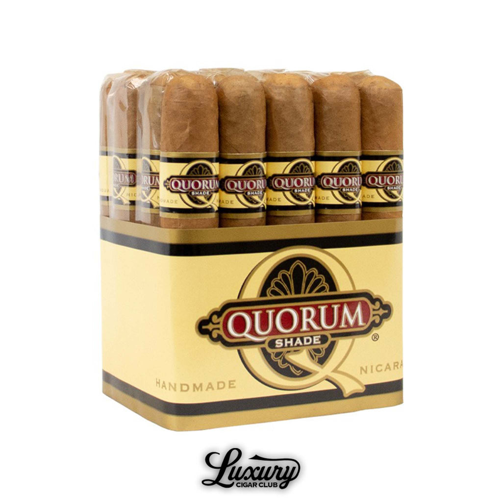 Bundle of Quorum Shade cigars handcrafted in Nicaragua, featuring smooth Ecuadorian Connecticut Shade wrappers and classic Quorum branding. The light golden box showcases the Quorum logo with “Handmade” and “Nicaragua” printed at the base, emphasizing its premium quality. Each cigar is cellophane-wrapped with a brown and gold Quorum Shade band, displayed neatly in rows above the Luxury Cigar Club logo. Luxury Cigar Club.