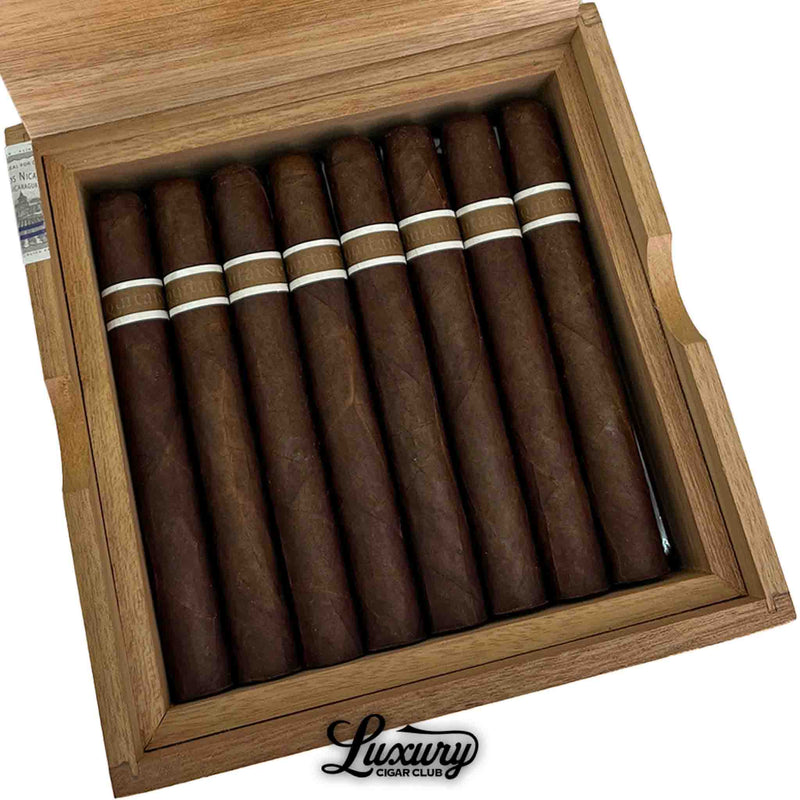 Close up of RoMa Craft Aquitaine Anthropology cigars in box with natural wood design from Luxury Cigar Club