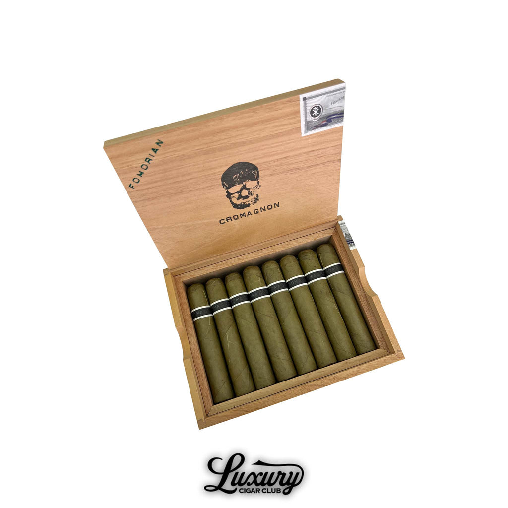 Open cedar box of RoMa Craft CroMagnon Fomorian EMH cigars with green candela wrapper displayed at Luxury Cigar Club.