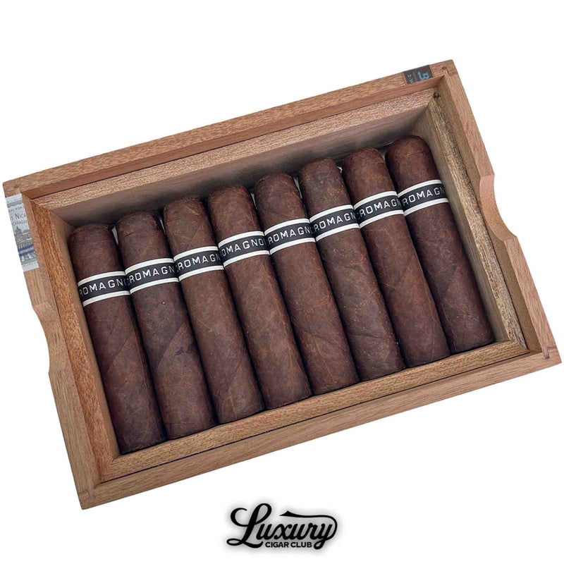 Close up of RoMa Craft CroMagnon Knuckle Dagger cigars displaying Pennsylvania Broadleaf wrapper and black white branding bands inside open cedar box at Luxury Cigar Club