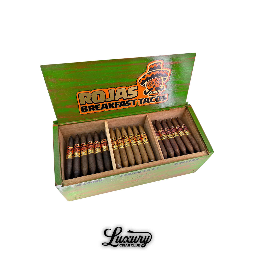 Rojas Breakfast Tacos Petite Salomon cigars displayed in a colorful green box featuring three wrapper varieties, showcasing the brand’s bold design and artisanal craftsmanship, presented by Luxury Cigar Club.
