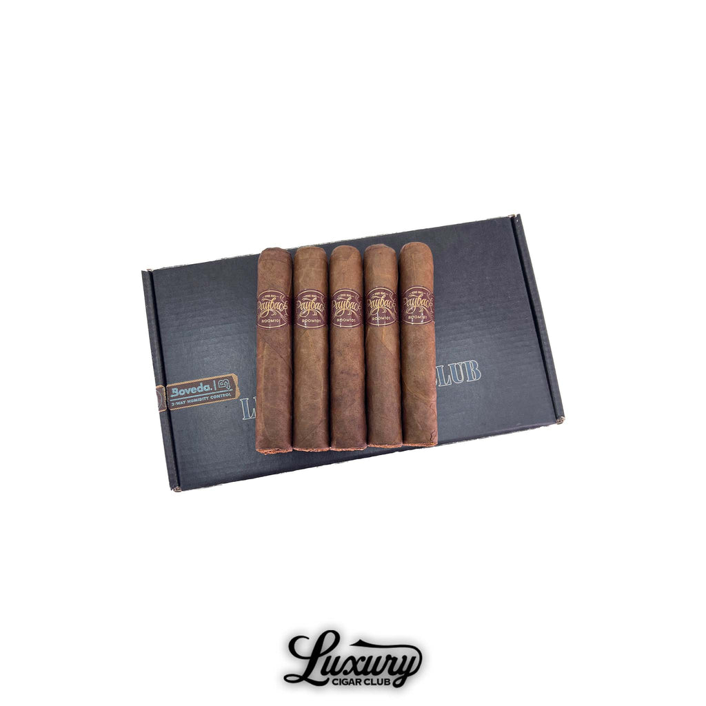 Room101 Big Payback Sumatra El Gran Papi Chulo cigars in a 5 pack resting on a Luxury Cigar Club black box with Boveda humidity pack logo.