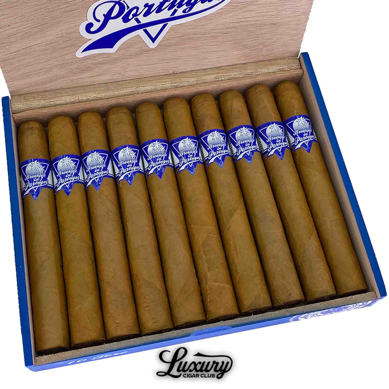 Detailed view of Breakfast in Portugal Toro cigars in box, showing golden Connecticut wrappers with blue cigar bands featuring the logo.