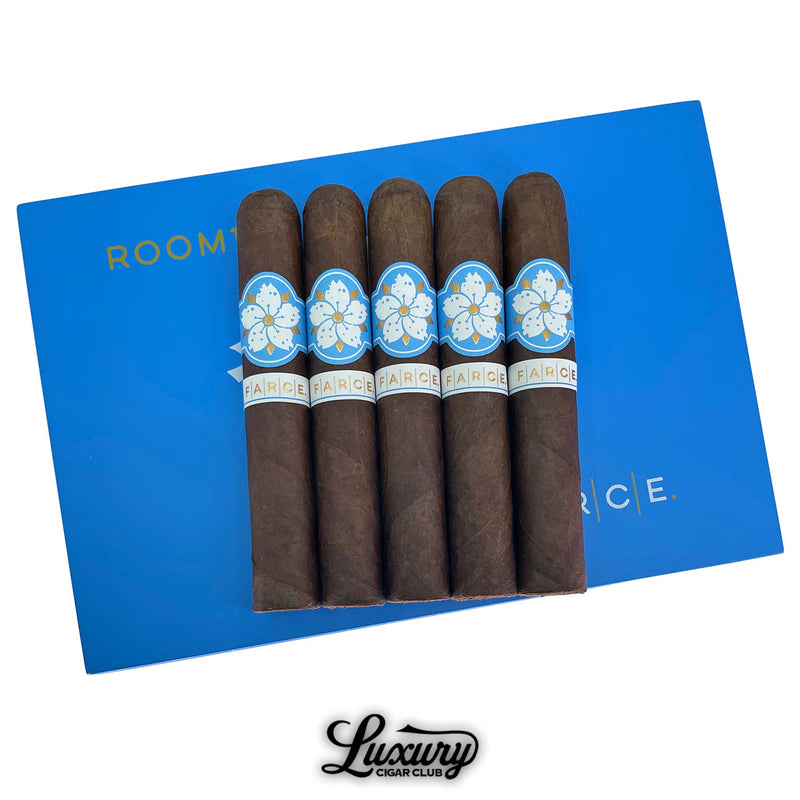 Luxury Cigar Club 5-pack of Room 101 Farce Nicaragua Gordo, showcasing dark, oily wrappers and blue floral cigar bands on bold blue packaging.