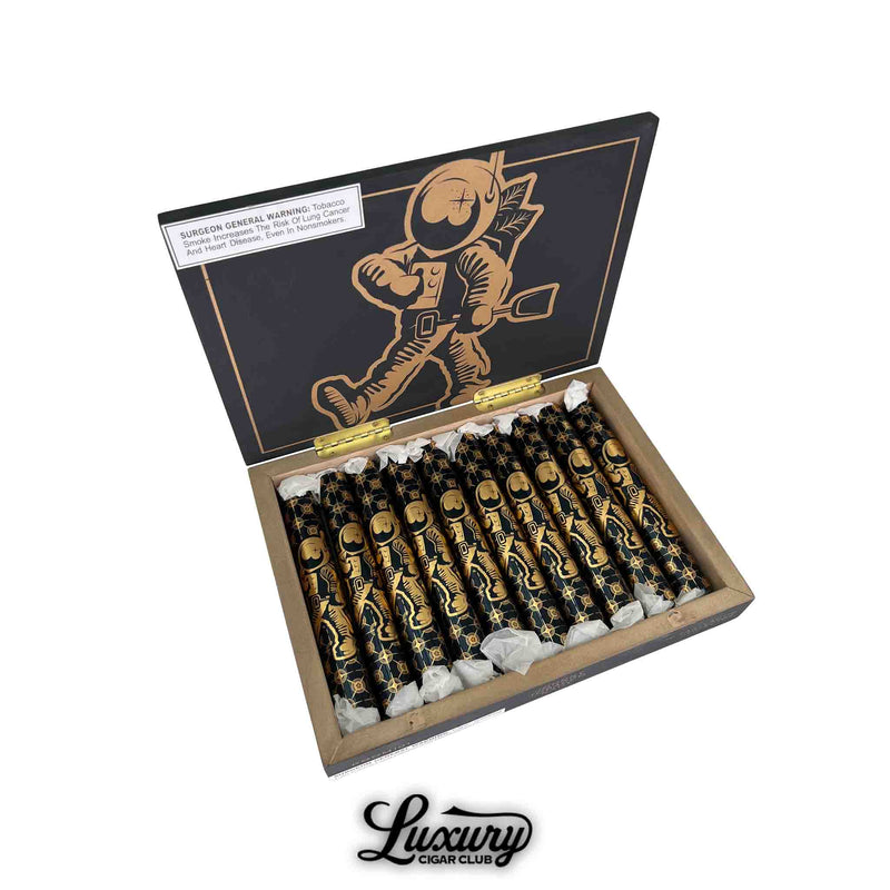 Open box of Room101 Johnny Tobacconaut Ranflactic Perfecto cigars, each individually wrapped in black and gold foil featuring astronaut artwork. The inside lid showcases a large gold-foil astronaut graphic. Luxury Cigar Club logo below.