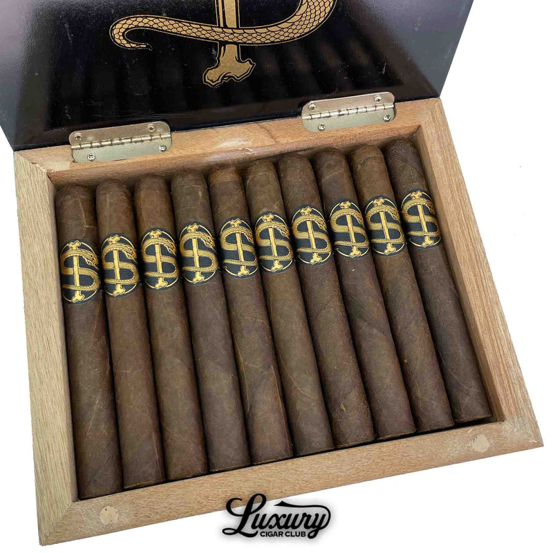 Close up view of Room 101 Snake Shake Limited LCC Exclusive Toro cigars with dark wrapper and black gold snake logo bands, presented in a wooden box