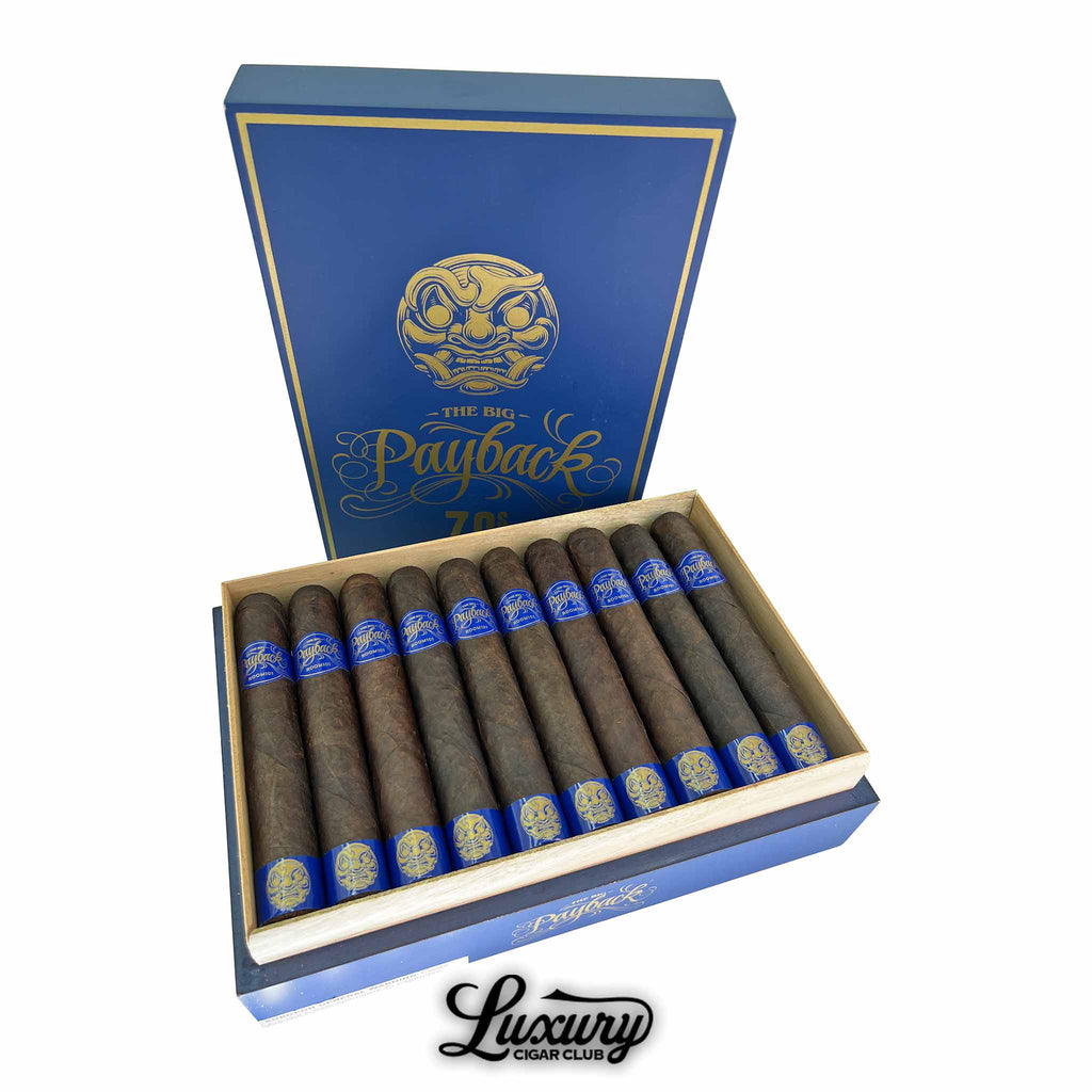 Open box of Room 101 The Big Payback 70s Maduro cigars with dark brown wrappers, each banded in bold blue and gold, presented in a blue and gold branded box with the logo inside the lid.