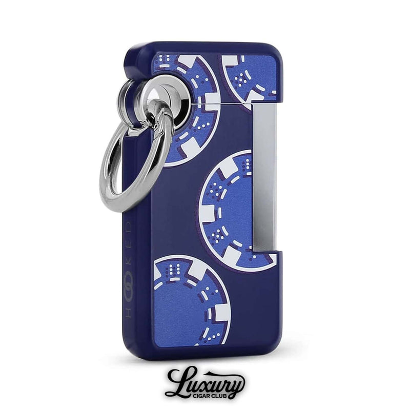 ST Dupont Hooked Single Jet Lighter in Casino edition, decorated with bold blue poker chip graphics, silver detailing, and signature hook ring, sold at Luxury Cigar Club.