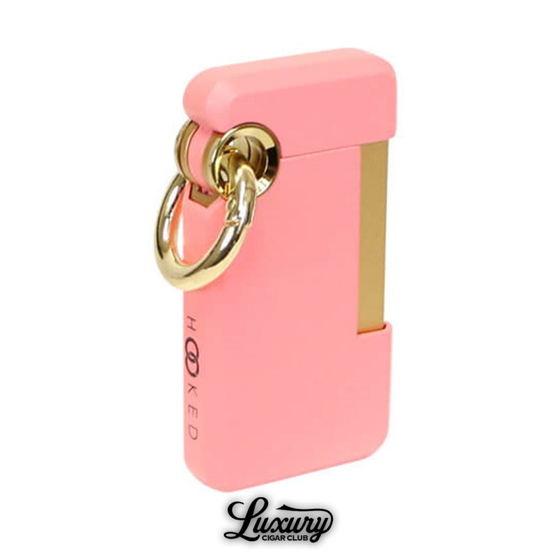Chic ST Dupont Hooked single jet lighter in soft pink lacquer with gold trim and oversized ring loop, feminine yet bold cigar accessory, available at Luxury Cigar Club.