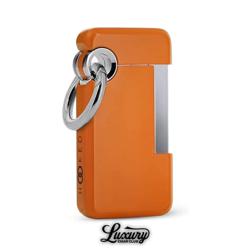 Sleek orange ST Dupont Hooked single jet flame lighter with minimalist lacquer finish and polished chrome details, lightweight pocket accessory for cigar lovers, available at Luxury Cigar Club.