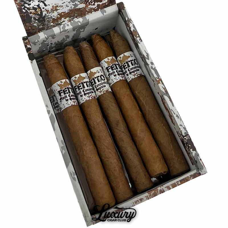 Close-up of Sagrado Feito From Connecticut Panatela cigars showing smooth light brown wrappers and distressed white cigar bands with “Feito From Connecticut” branding. Luxury Cigar Club logo visible.