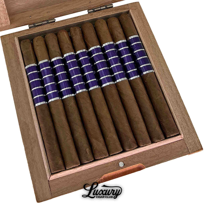 Close-up of Sans Pareil Purple Laguito cigars showing rich brown wrappers and metallic purple bands, emphasizing the refined craftsmanship, from Luxury Cigar Club.
