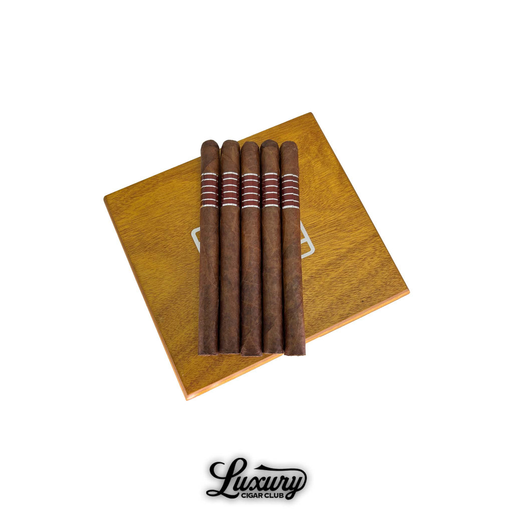 Sans Pareil Red A cigars displayed on an elegant wooden box, highlighting their refined craftsmanship and deep brown wrapper, available at Luxury Cigar Club.