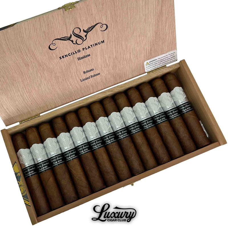 Close-up of Sencillo Platinum Robusto cigars inside a wooden box, featuring silver embossed bands and black label reading Edición Limitada 2024.