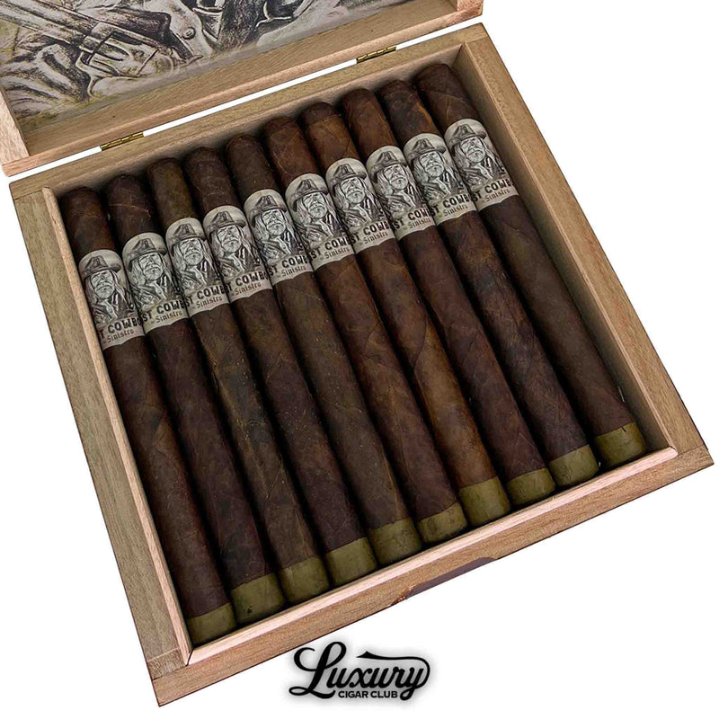 Close-up of an open wooden cigar box containing twelve Sinistro The Last Cowboy Maduro Churchill cigars. Each cigar features a closed foot and a detailed black-and-white band with a cowboy illustration and “The Last Cowboy by Sinistro” branding. The cigars are neatly arranged above the Luxury Cigar Club logo.