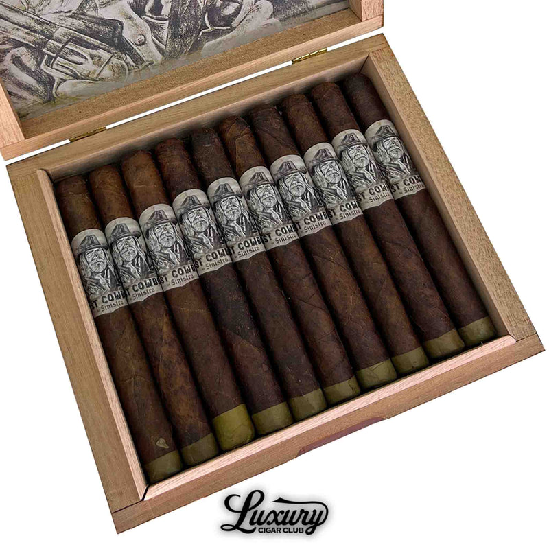 Close-up of an open wooden box containing twelve Sinistro The Last Cowboy Maduro Corona cigars. Each cigar features a closed foot and a band with intricate cowboy-themed black-and-white artwork labeled “The Last Cowboy by Sinistro.” The cigars are neatly aligned above the Luxury Cigar Club logo.