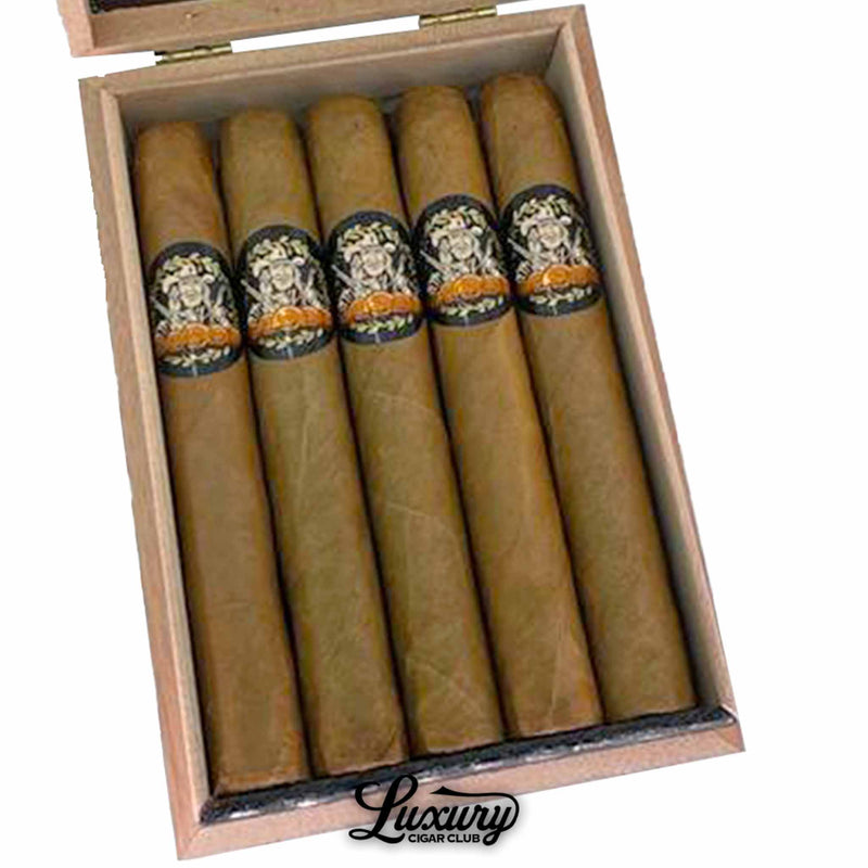 Close-up of Sinistro Year of the Cowboy Natural Limited Edition Toro cigars showing golden brown wrappers and detailed black-and-gold bands with signature Sinistro design. Luxury Cigar Club logo visible.