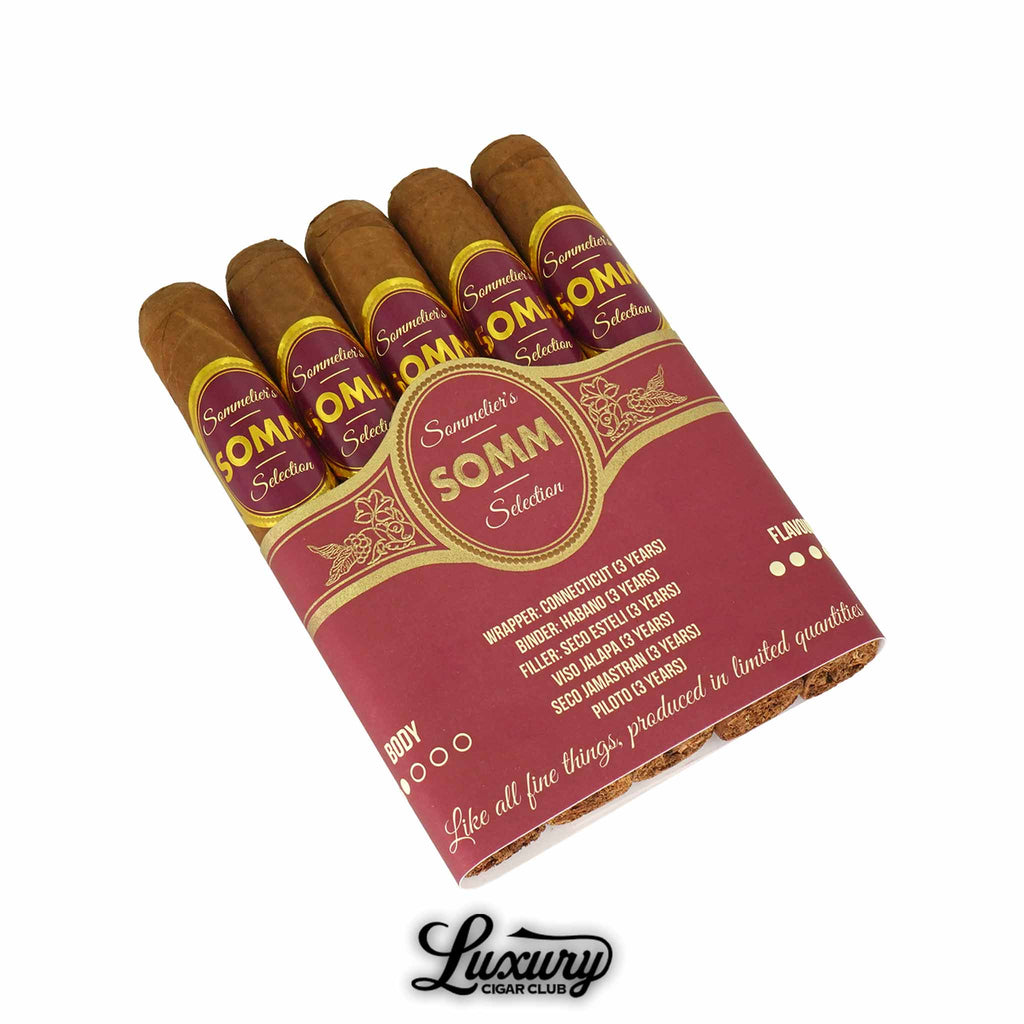 Somm BDX Blanc Robusto cigars in a vibrant red and gold bundle, featuring smooth Connecticut wrappers and elegant band design, presented by Luxury Cigar Club.