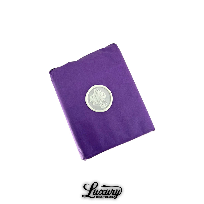 Stolen Throne Castle 919 Belicoso cigars wrapped in purple paper with silver logo seal, boutique premium cigar packaging at Luxury Cigar Club.
