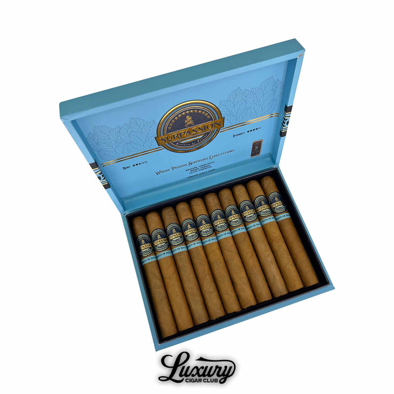Open box of Surpassion Queen of Battle Toro cigars showcasing twelve premium handmade cigars with elegant blue and gold bands, displayed by Luxury Cigar Club.