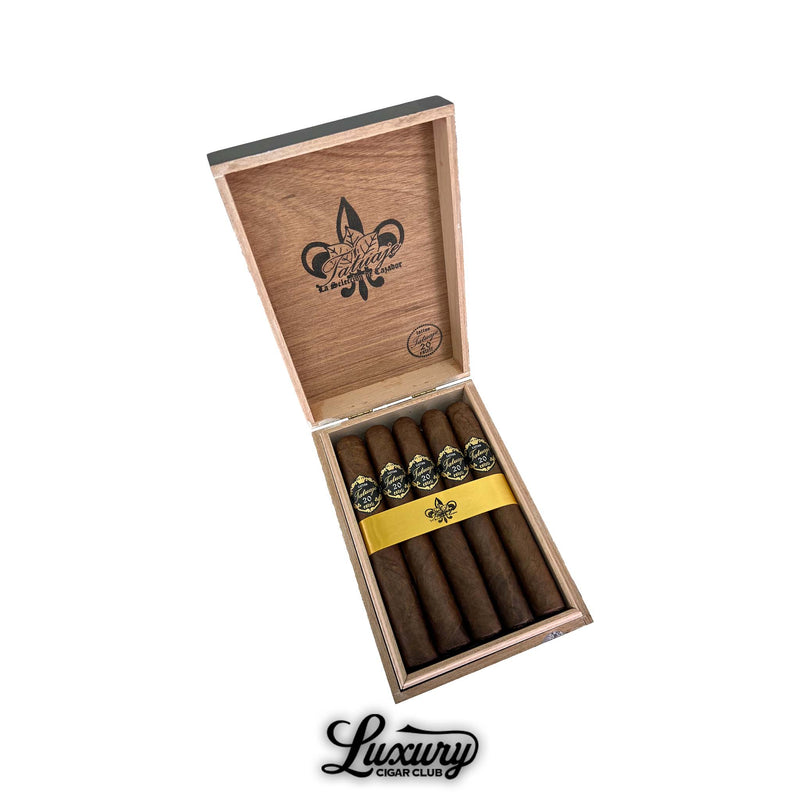 tatuaje 20th anniversary grand chasseur cigars displayed in an open wooden box from luxury cigar club with a yellow ribbon and black and gold bands
