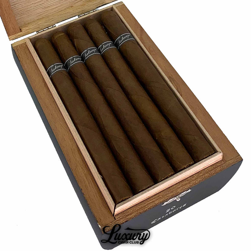 Close up view of Tatuaje Black Cazadores cigars inside wooden box with black bands from Luxury Cigar Club