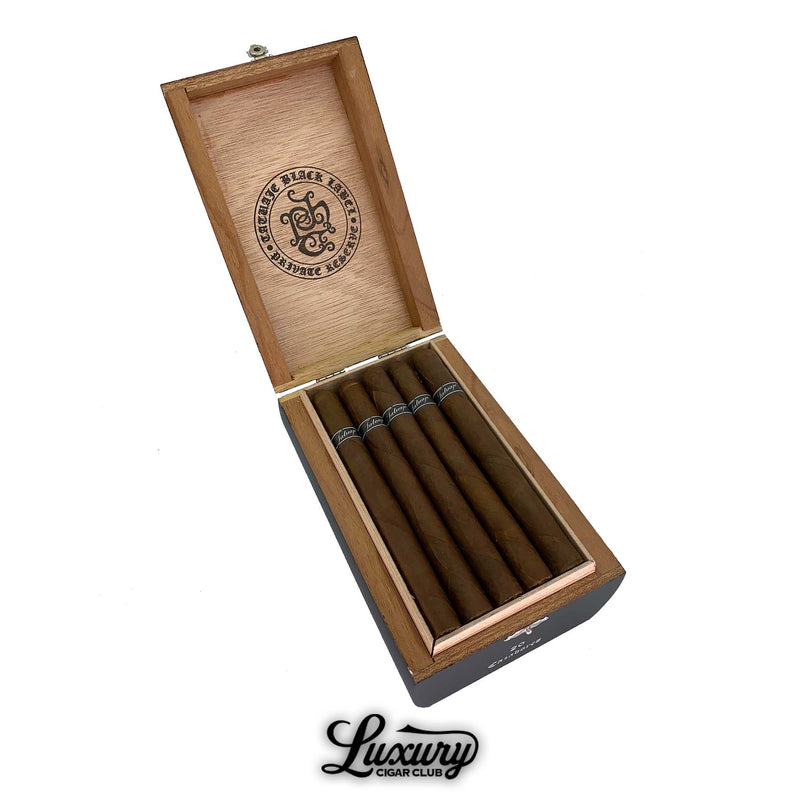 Open wooden box of Tatuaje Black Cazadores cigars with black cigar bands displayed by Luxury Cigar Club