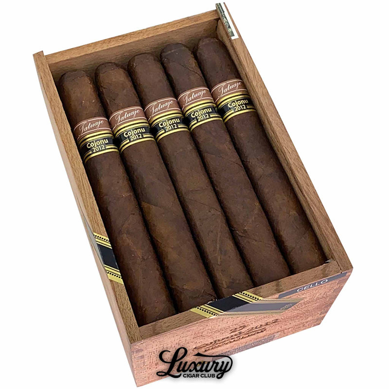 Close up view of Tatuaje Cojonu 2012 Broadleaf cigars inside the open wooden box at Luxury Cigar Club