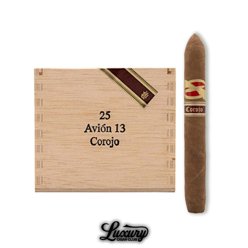 Image of a Tatuaje Avion 13 Corojo cigar next to its branded wooden box of 25, with pointed torpedo shape and red-gold banding, displayed above the Luxury Cigar Club logo.