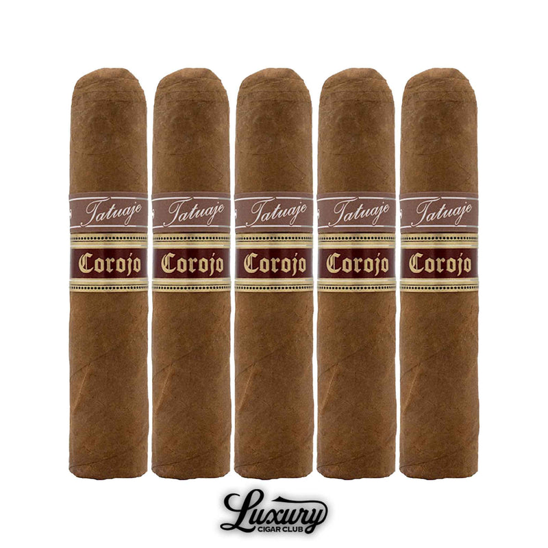 Five Tatuaje Cohetes Corojo cigars in a row with brown and gold bands, positioned above the Luxury Cigar Club logo.