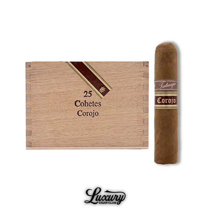 Image of a Tatuaje Cohetes Corojo cigar next to its wooden box of 25, with band details in brown, gold, and cream, displayed above the Luxury Cigar Club logo.