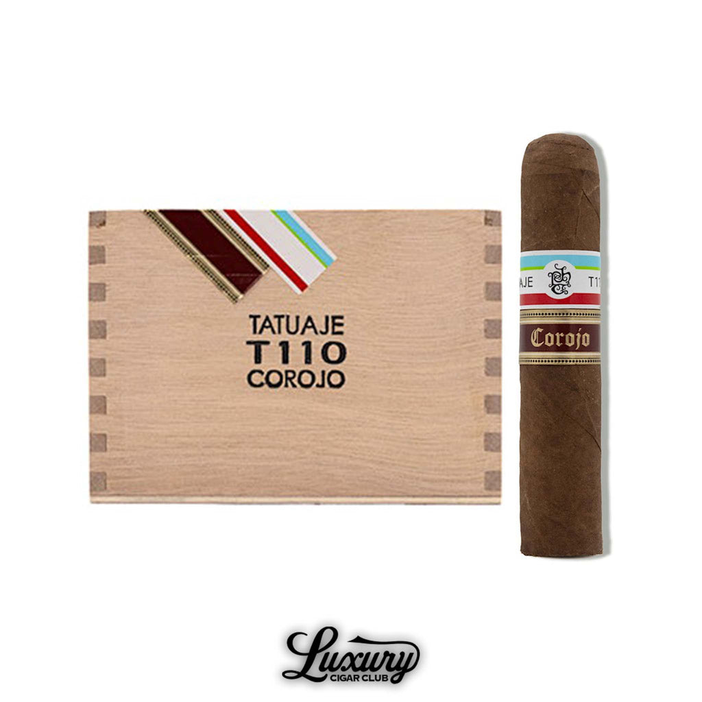 Tatuaje T110 Corojo cigar standing upright beside a closed wooden box labeled “Tatuaje T110 Corojo,” with brown and cream banding, shown above the Luxury Cigar Club logo.