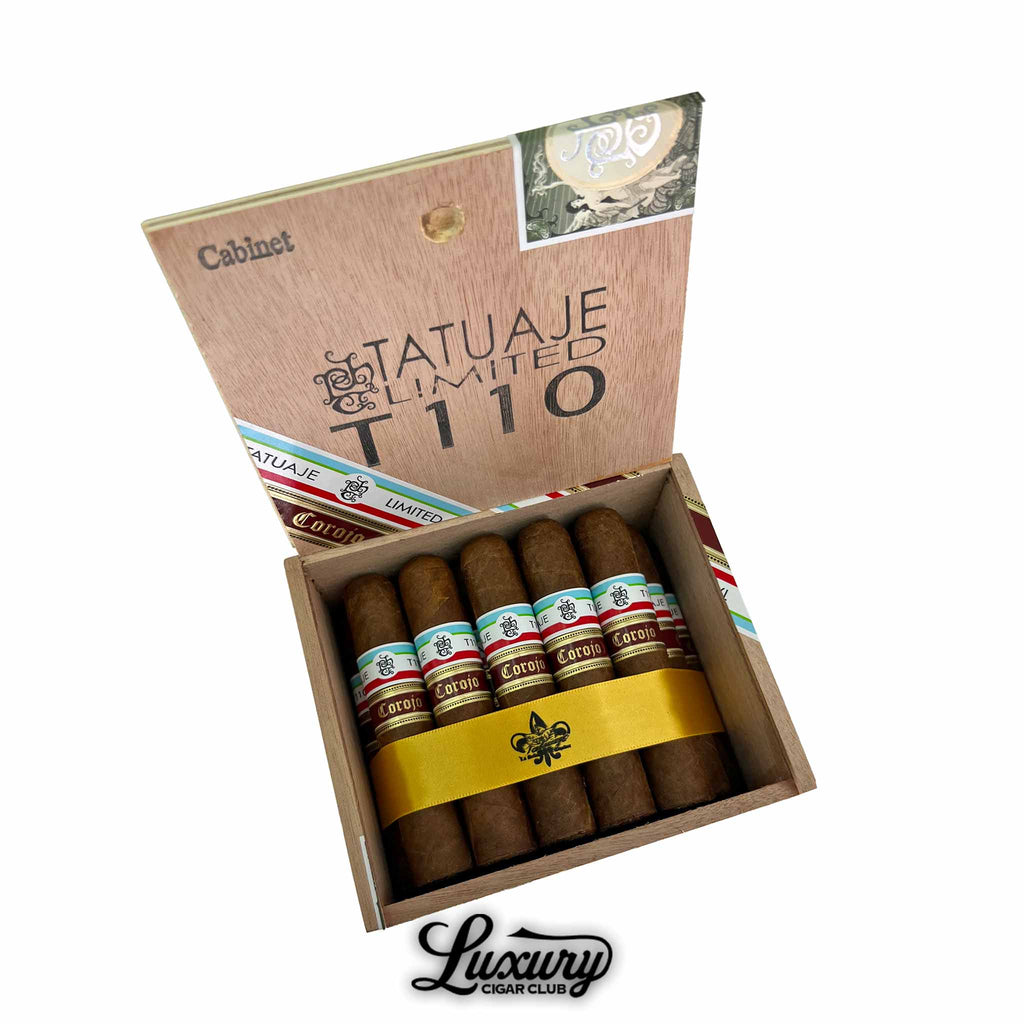 Open box of Tatuaje Corojo Series Limited Edition T110 cigars featuring bold tri color bands and Corojo designation from Luxury Cigar Club